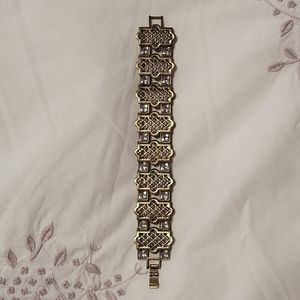 Golden bracelet with cubic zirconia